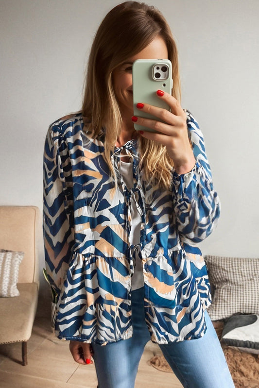 Women's blouse with puff sleeves and blue zebra pattern