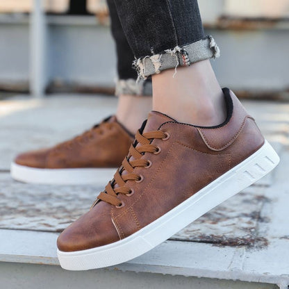 Men's lace-up shoes with low shaft, round toe area, and rubber sole