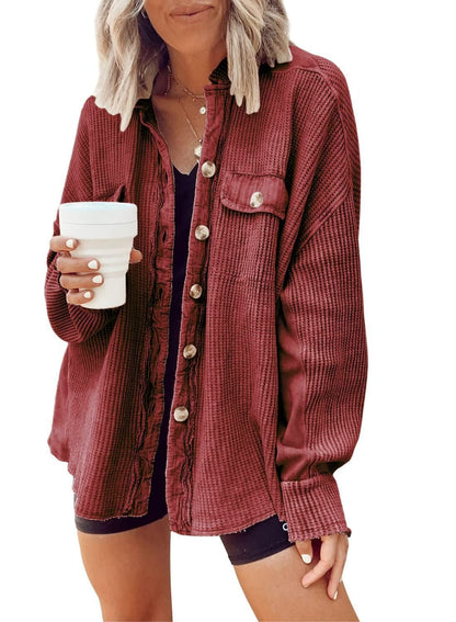 Women's shirt jacket with notch collar, front pockets, and asymmetrical hem