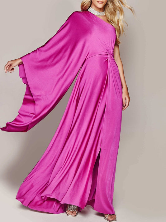 Elegantes pinkes Abendkleid mit asymmetrischem Schnitt und fließendem Stoff, getragen von einer Frau. Perfekt für formelle Anlässe und Events.