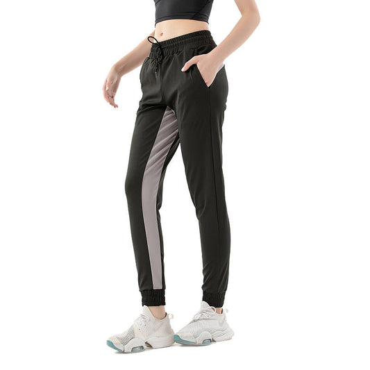 Women's sports trousers with contrasting inserts and quick-drying design