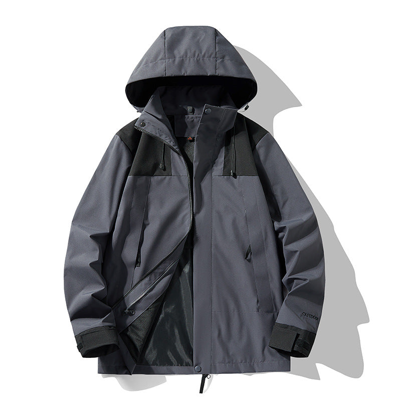 Graue Outdoor-Jacke mit Kapuze, wasserdicht und winddicht, ideal für Herren. Funktionale Taschen, Reißverschluss, atmungsaktives Material. Perfekt für Wandern.