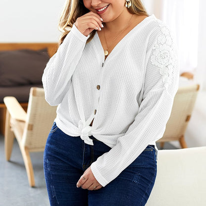 Women's knitted sweater with V-neck, long sleeves, and button details