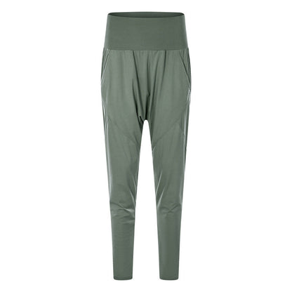 Grüne Damen-Jogginghose mit hohem Bund, elastischem Material und Seitentaschen. Bequeme Sporthose für Fitness und Freizeit.