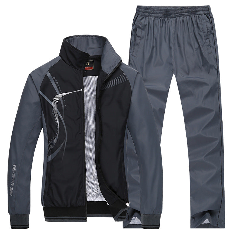 Grauer Herren-Trainingsanzug mit Jacke und Hose, sportliches Design, atmungsaktives Material, ideal für Fitness und Freizeitaktivitäten.