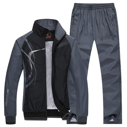 Grauer Herren-Trainingsanzug mit Jacke und Hose, sportliches Design, atmungsaktives Material, ideal für Fitness und Freizeitaktivitäten.