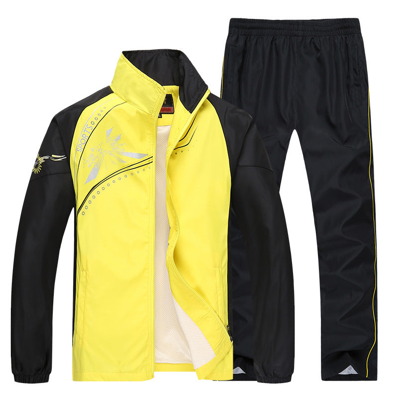 Gelber und schwarzer Trainingsanzug für Herren, bestehend aus Jacke und Hose. Sportbekleidung, atmungsaktiv, ideal für Outdoor-Aktivitäten.