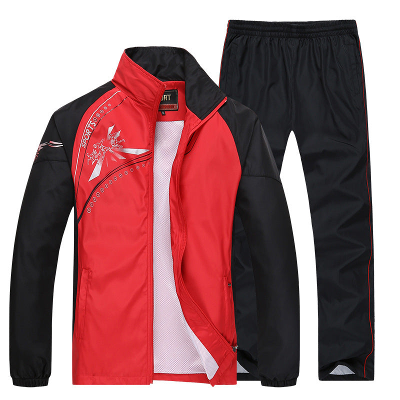 Roter und schwarzer Sportanzug für Herren, bestehend aus Jacke mit Reißverschluss und Hose. Ideal für Outdoor-Aktivitäten und Fitness.