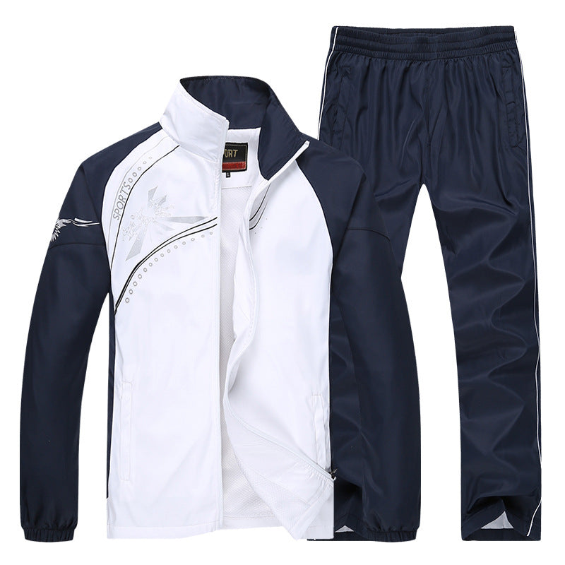 Zweiteiliger Sportanzug für Herren, bestehend aus weißer Jacke mit blauen Ärmeln und blauer Hose. Ideal für Fitness, Training und Freizeit.