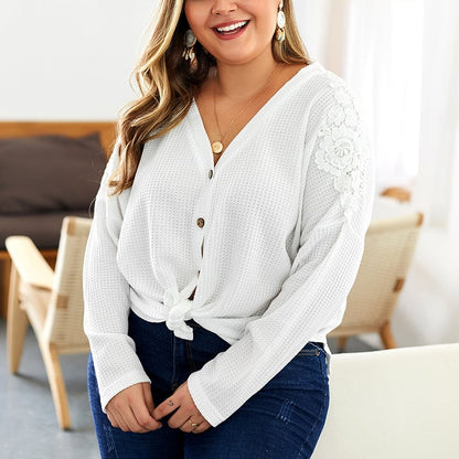 Women's knitted sweater with V-neck, long sleeves, and button details