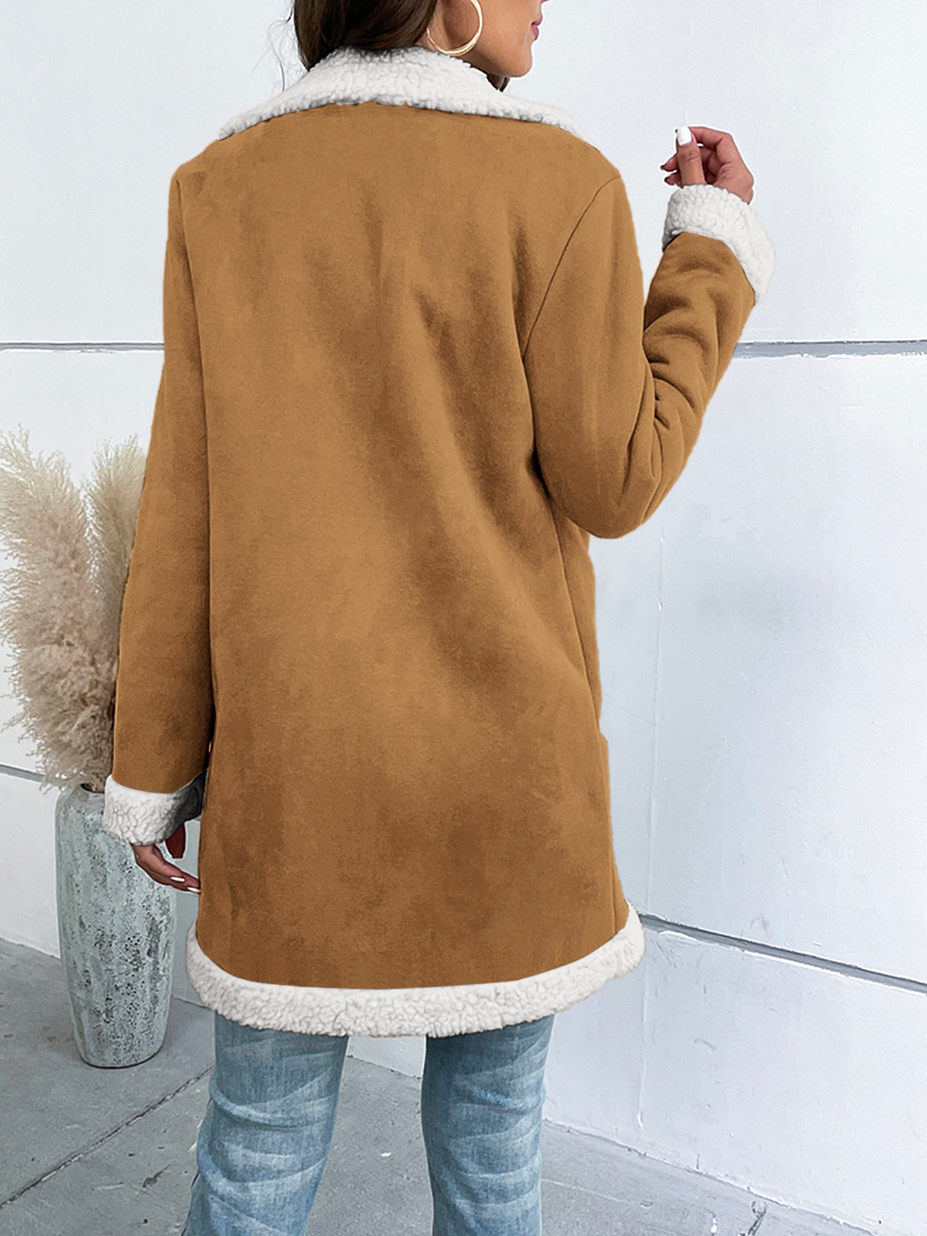 Women's long winter coat with lapel collar and solid suede look