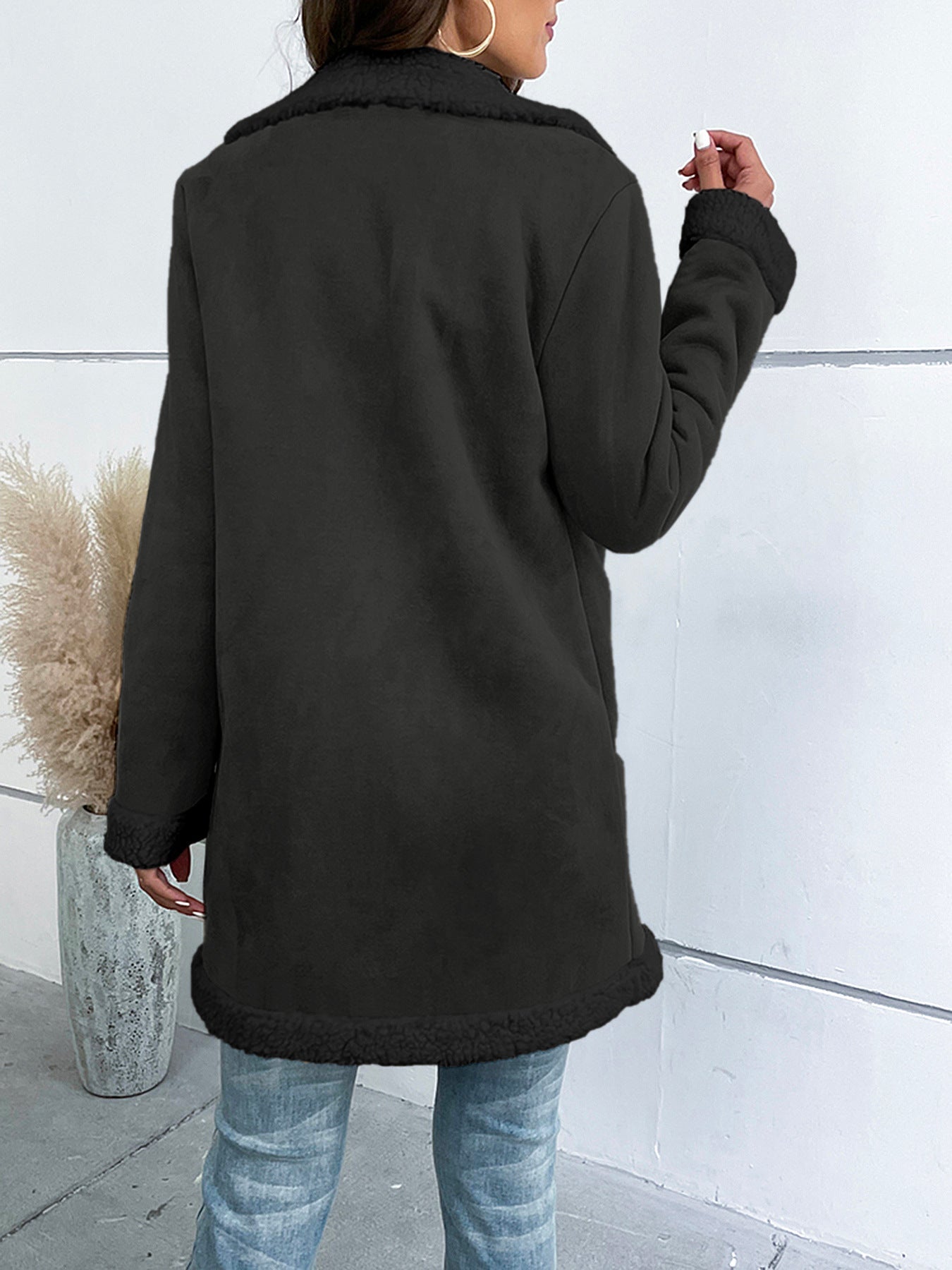 Women's long winter coat with lapel collar and solid suede look