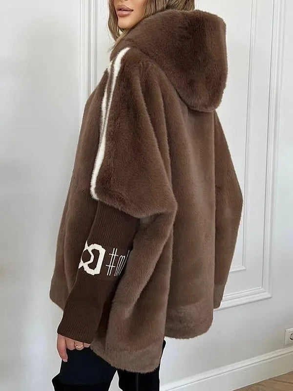 Women's winter coat made of faux fur with hood and contrasting sleeves