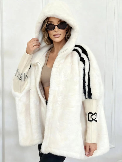 Women's winter coat made of faux fur with hood and contrasting sleeves