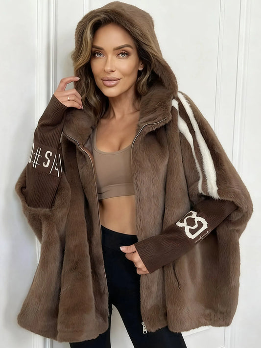 Women's winter coat made of faux fur with hood and contrasting sleeves