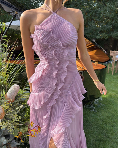Women's summer dress with open back, tie belt, and flounced hem