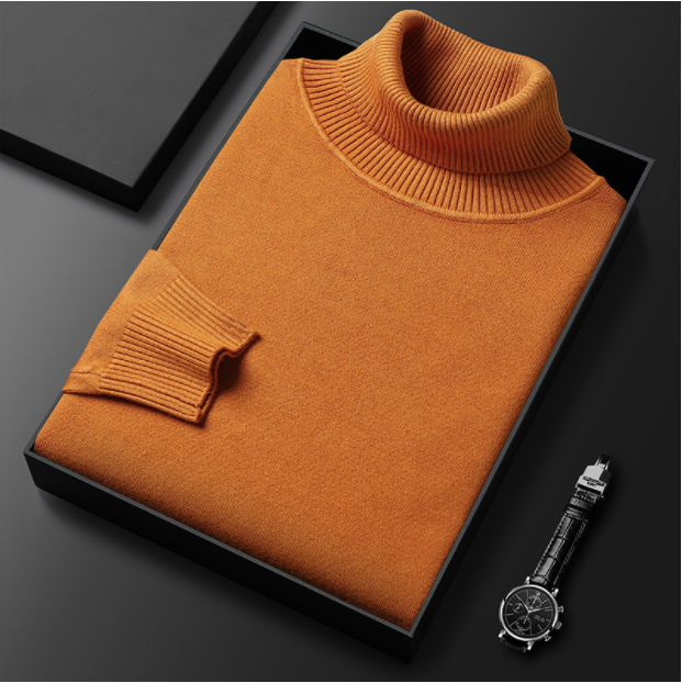 Orangefarbener Rollkragenpullover in schwarzer Geschenkbox, daneben eine elegante Armbanduhr. Hochwertige Modeaccessoires, stilvolles Design.