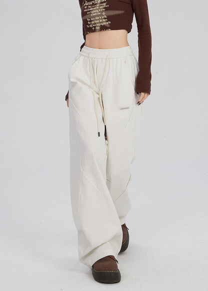 Women's trousers with wide legs and straight cut as well as mid-rise waistband