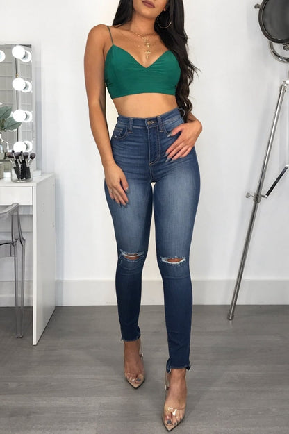 Women's jeans with mid-rise waist, slim fit, and hip lifting made from cotton blend fabric
