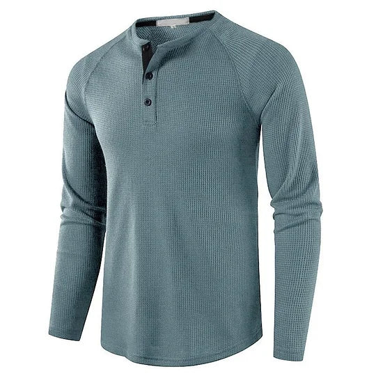 Langarm-Henley-Shirt für Herren in Blau, mit Knopfleiste und geripptem Stoff. Ideal für Freizeitmode und Herbstbekleidung.