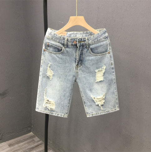 Men's denim shorts with a used look and rips, mid-rise waistband