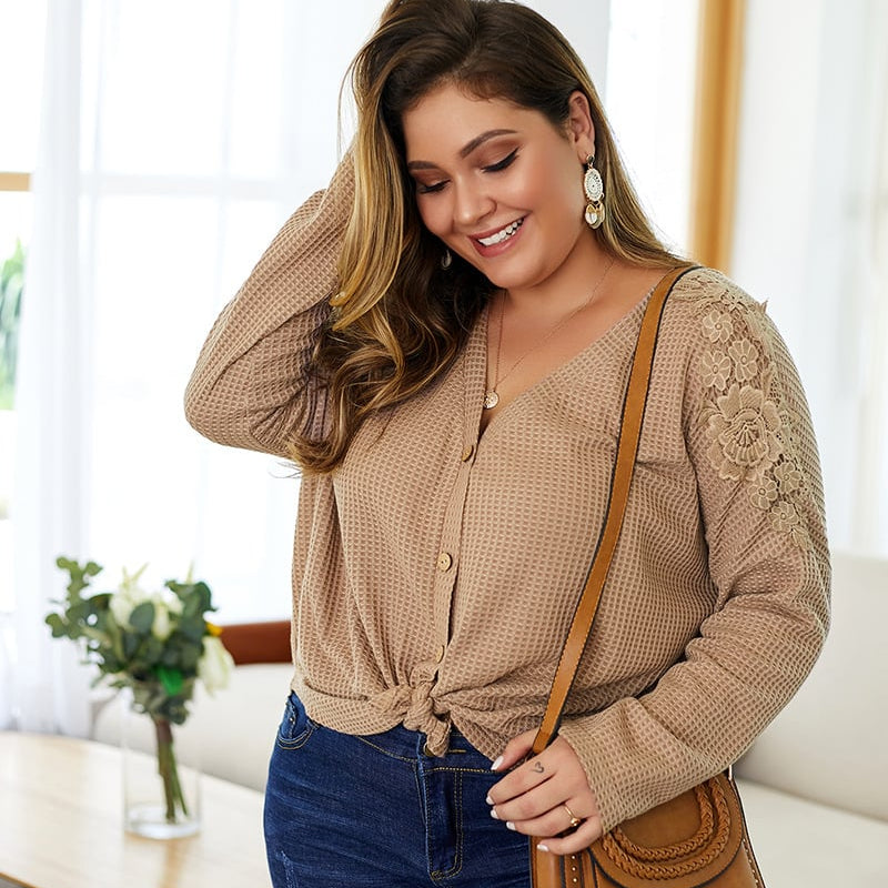 Women's knitted sweater with V-neck, long sleeves, and button details