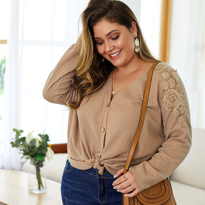 Women's knitted sweater with V-neck, long sleeves, and button details