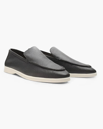 Schwarze Lederloafer für Herren mit weißer Sohle, elegantes Design, ideal für Business und Freizeit. Hochwertige Herrenschuhe, modern und stilvoll.