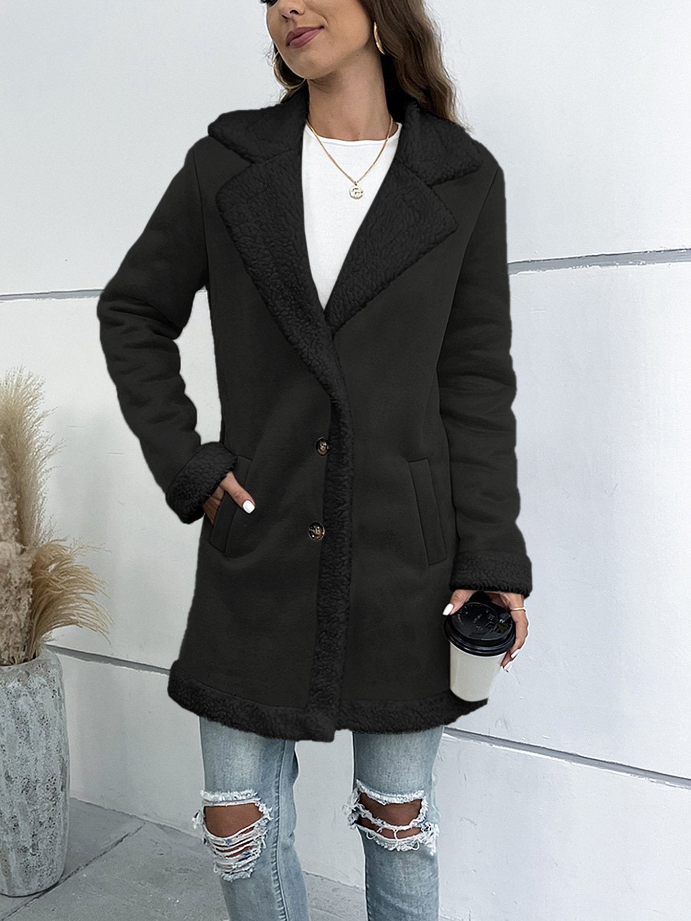Women's long winter coat with lapel collar and solid suede look