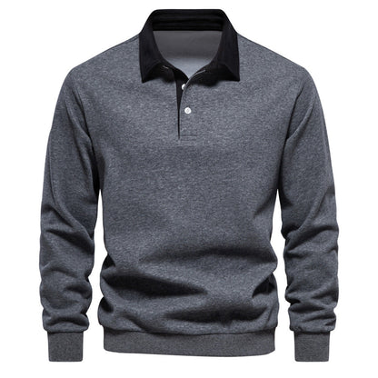 Graues Herren-Poloshirt mit langen Ärmeln und schwarzem Kragen. Stilvolles, elegantes Design, ideal für Freizeit und Business. Hochwertige Baumwolle.