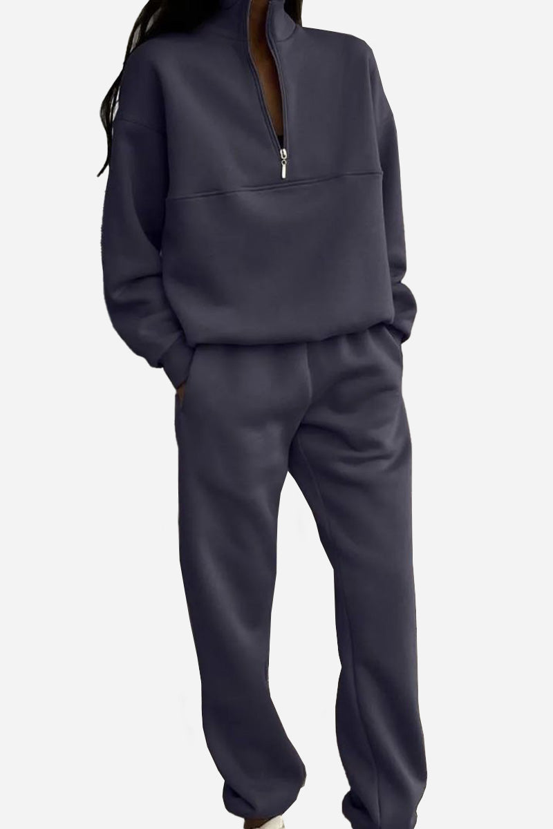 Dunkelgrauer Damen-Jogginganzug mit Reißverschluss, lässig und bequem, ideal für Freizeit und Sport. Modischer Zweiteiler für Damen.