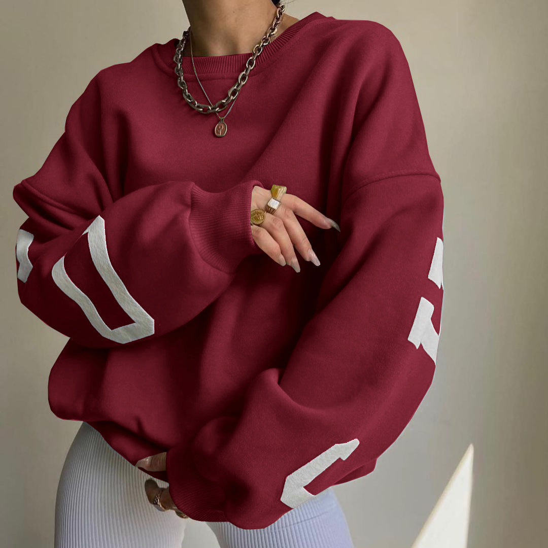 Women's top with print, round neckline, and long sleeves, loose fit