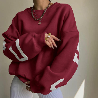 Women's top with print, round neckline, and long sleeves, loose fit