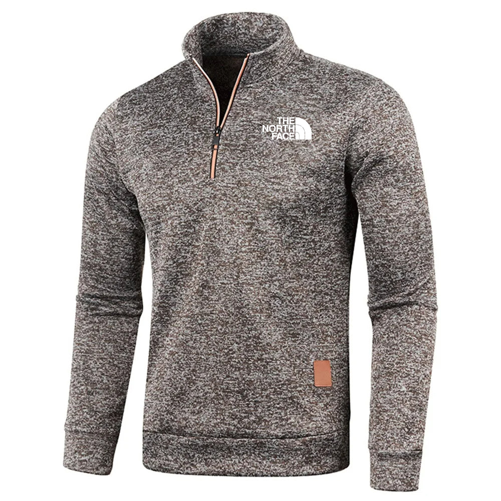 Grauer The North Face Pullover mit Reißverschluss, langärmelig, aus Fleece. Ideal für Outdoor-Aktivitäten und Freizeitmode.