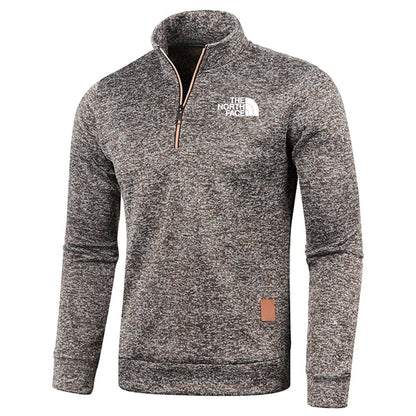 Grauer The North Face Pullover mit Reißverschluss, langärmelig, aus Fleece. Ideal für Outdoor-Aktivitäten und Freizeitmode.