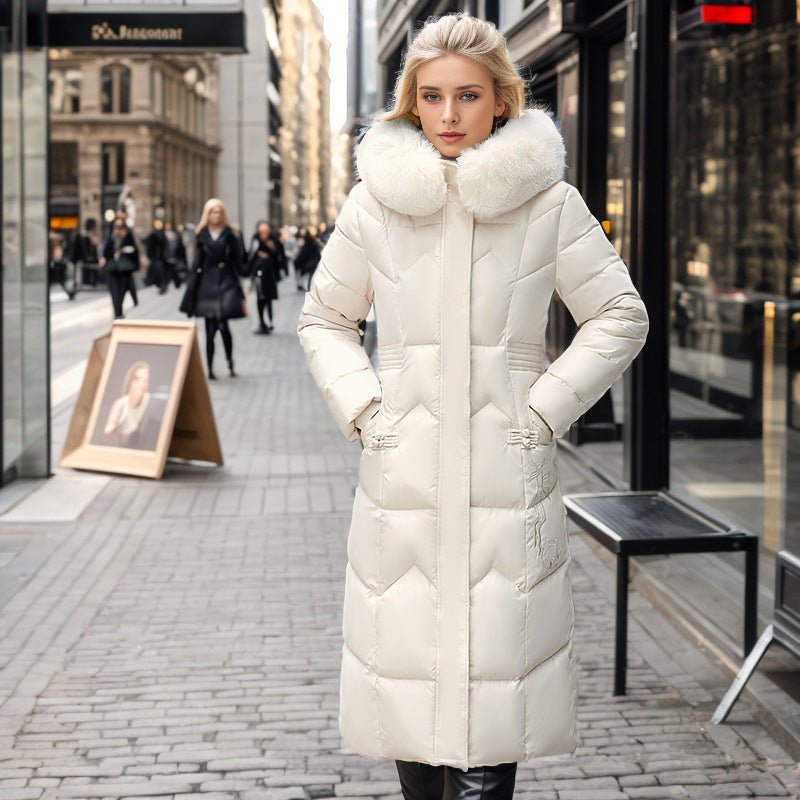 Women's long winter coat with faux fur collar and quilted design
