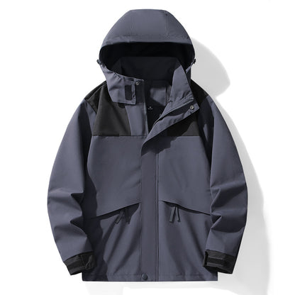 Graue Outdoor-Jacke mit Kapuze, wasserdicht und winddicht, ideal für Herren. Funktionale Taschen, modernes Design, perfekt für Wandern und Trekking.