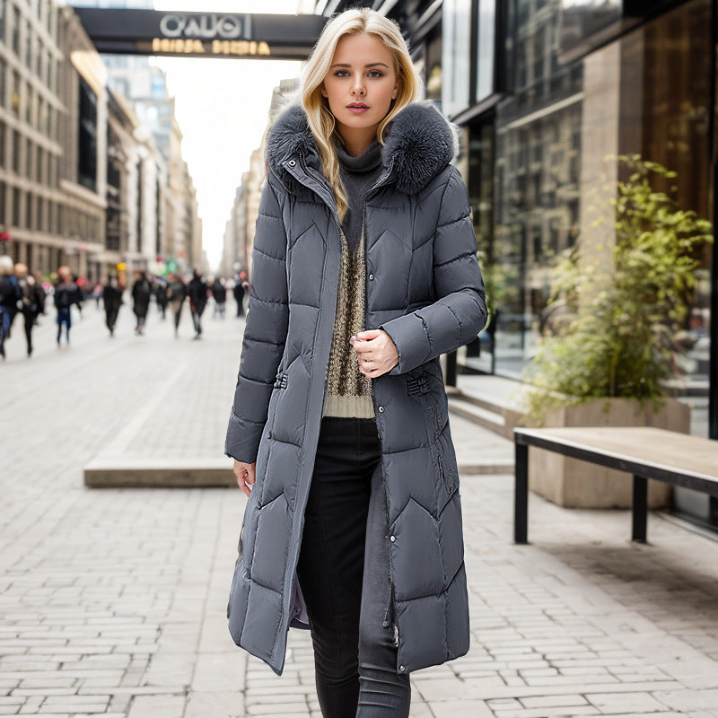 Women's long winter coat with faux fur collar and quilted design