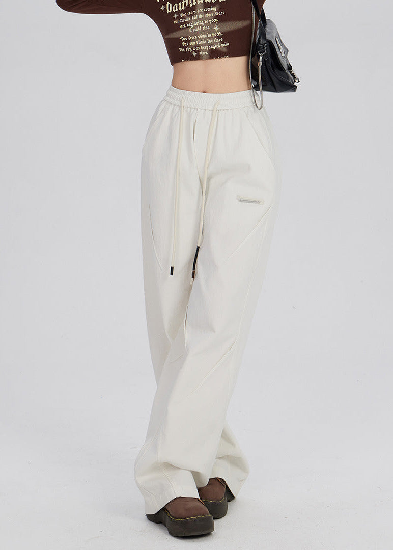 Women's trousers with wide legs and straight cut as well as mid-rise waistband