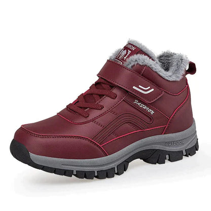 Bordeauxrote Winterstiefel mit Kunstfellfutter, Klettverschluss und rutschfester Sohle. Ideal für Outdoor-Aktivitäten und kaltes Wetter.