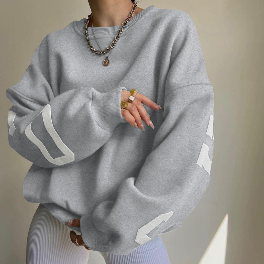 Women's top with print, round neckline, and long sleeves, loose fit