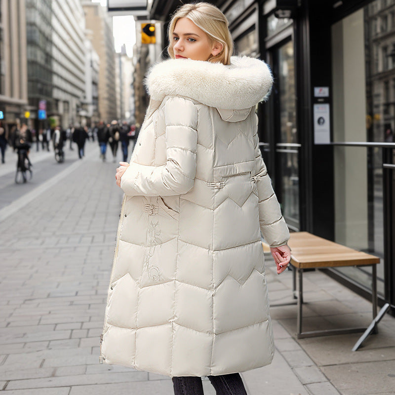 Women's long winter coat with faux fur collar and quilted design