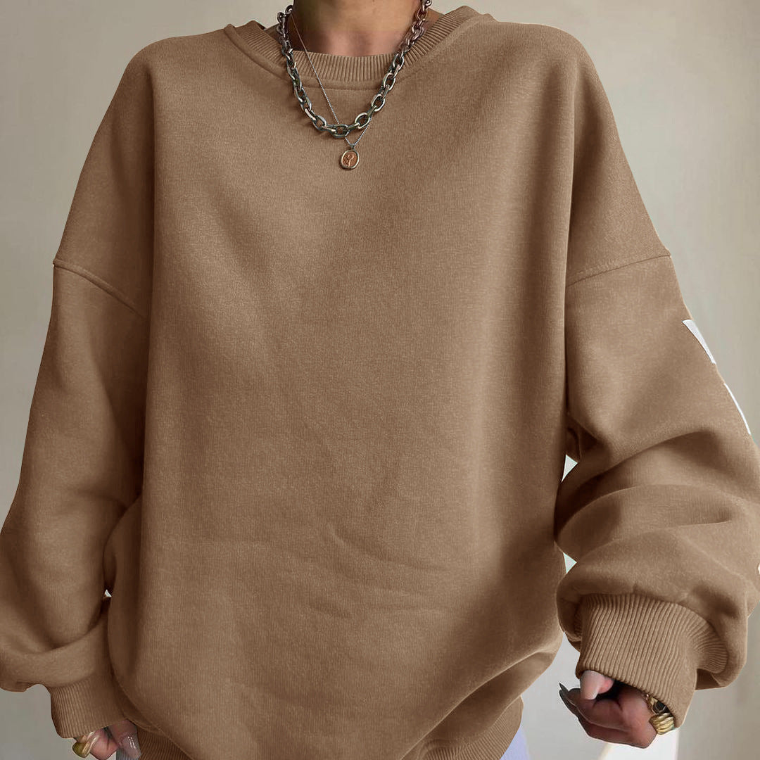 Women's top with print, round neckline, and long sleeves, loose fit