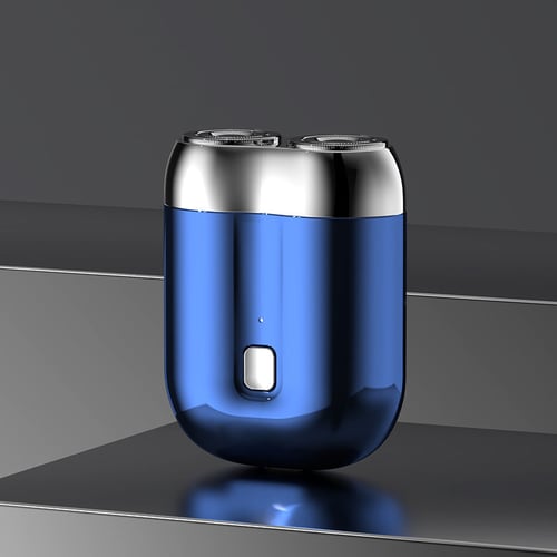Blauer elektrischer Rasierer mit zwei rotierenden Köpfen auf grauem Hintergrund. Modernes Design, kabellos, ideal für präzise Rasur.
