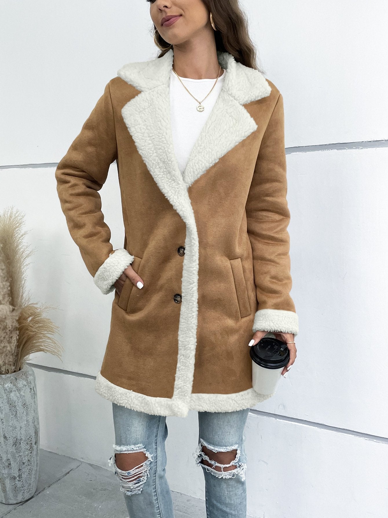 Women's long winter coat with lapel collar and solid suede look