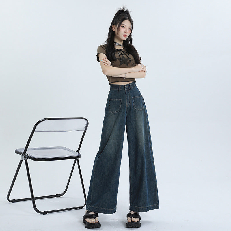 Women's high-waisted retro pants with wide, straight legs in denim mix