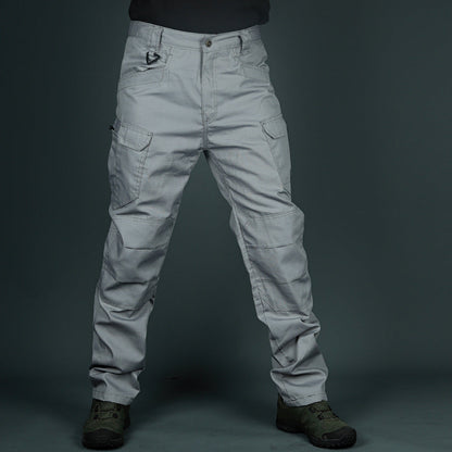 Graue taktische Hose mit mehreren Taschen, robustem Stoff und Outdoor-Design, ideal für Wandern und Abenteuer. Perfekt für Outdoor-Enthusiasten.