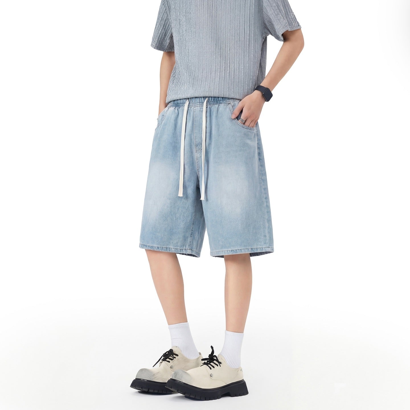 Men's denim shorts with stretch waistband, straight leg, and shortened fit