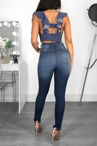 Women's jeans with mid-rise waist, slim fit, and hip lifting made from cotton blend fabric