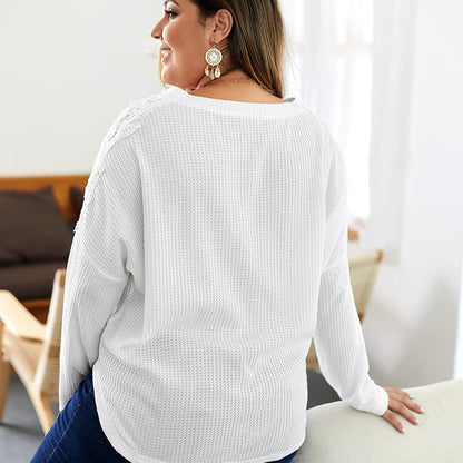 Women's knitted sweater with V-neck, long sleeves, and button details